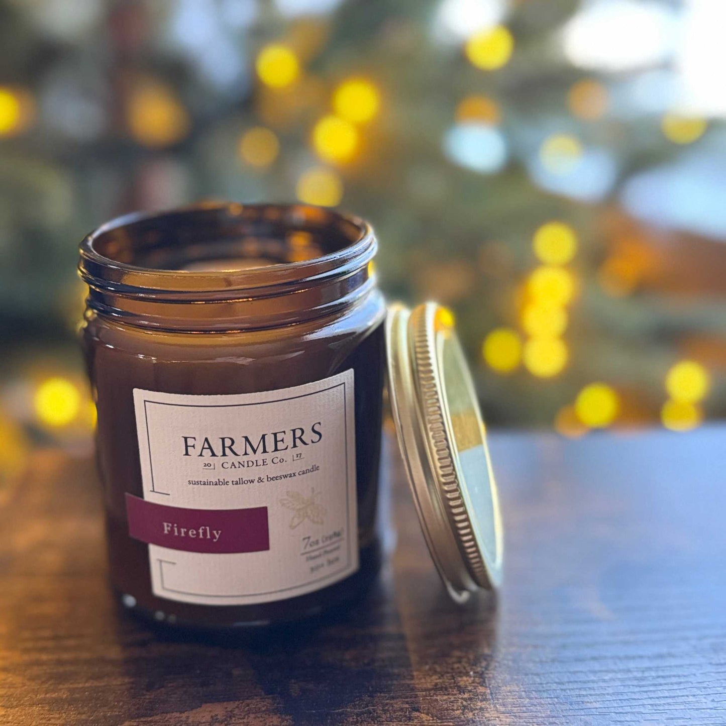 Firefly fragrance candle inspired by Wauwatosa holiday with orange, lemon, apple cider, and cranberry scents