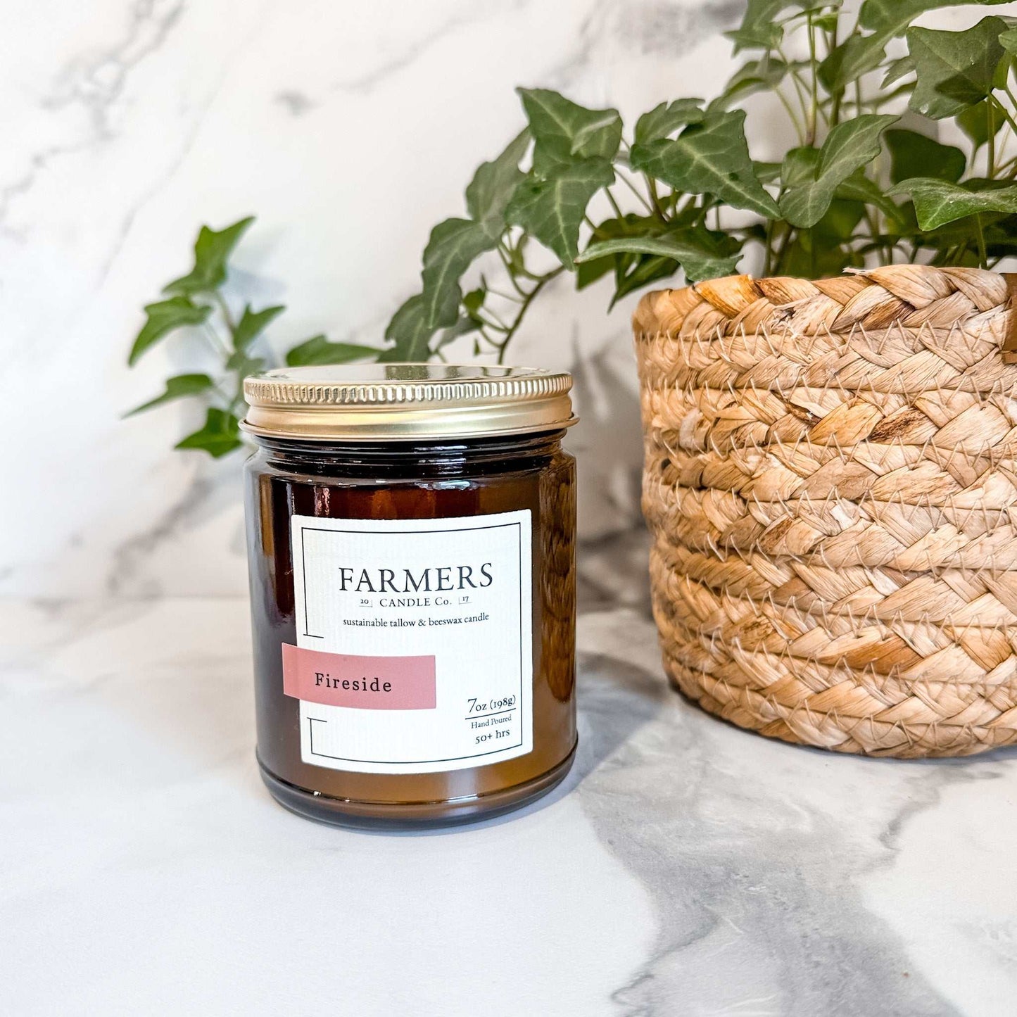 Cozy Fireside candle with smoky wood, clove, amber, sandalwood, and patchouli scent