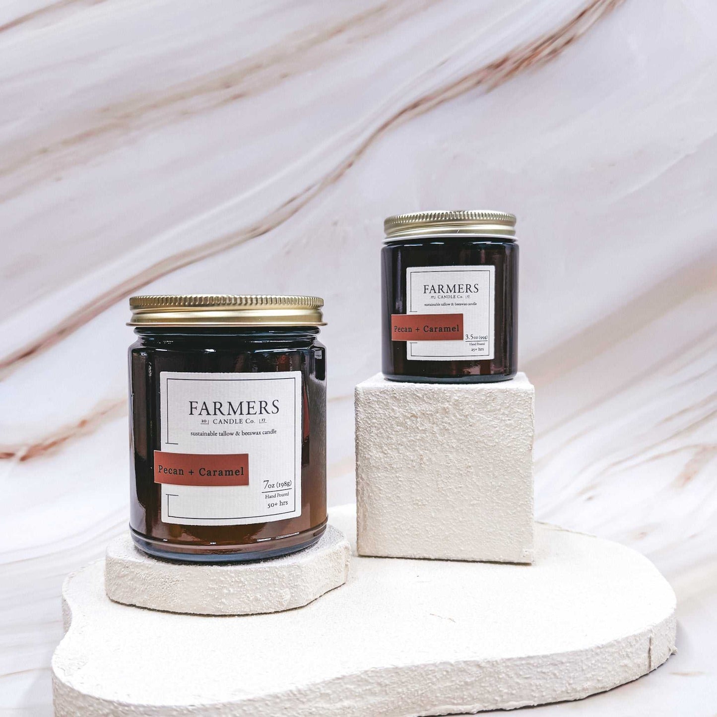 Pecan + Caramel scented candles with notes of butter, orange peel, caramel, maple, and pumpkin in amber jars